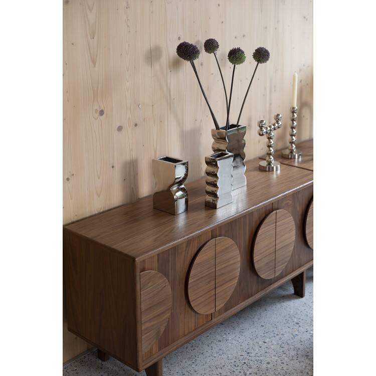 Zuiver Groove Large Walnut Sideboard displaying a vase and decor